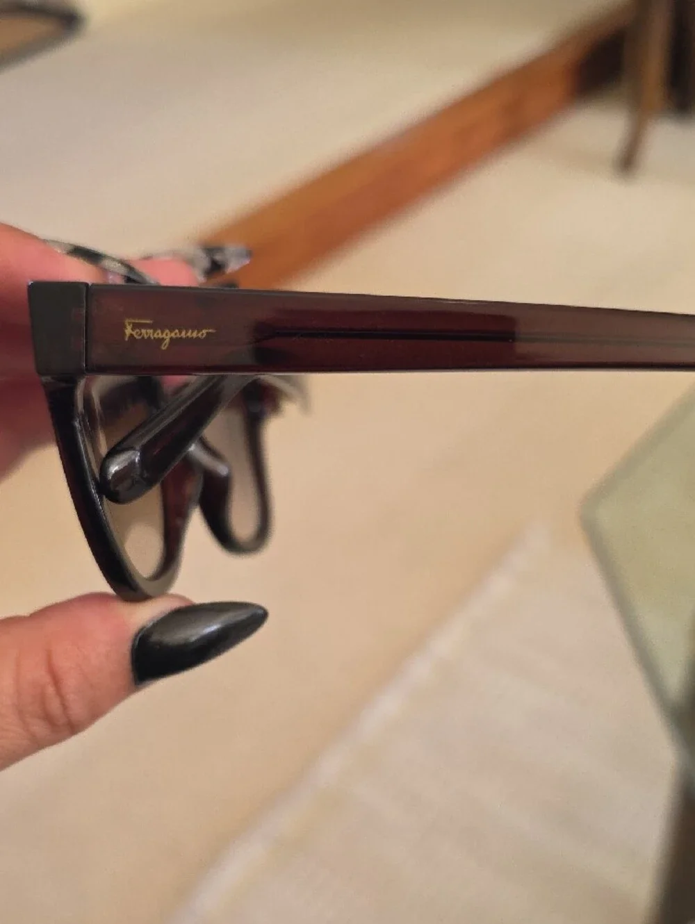 Salvatore Ferragamo SF1066S sunglasses feature a dark crystal brown frame